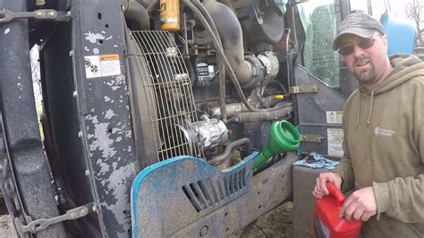 new holland skid steer oil change video|new holland l220 oil change video.